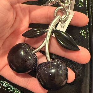 Coach signature black cherry charm